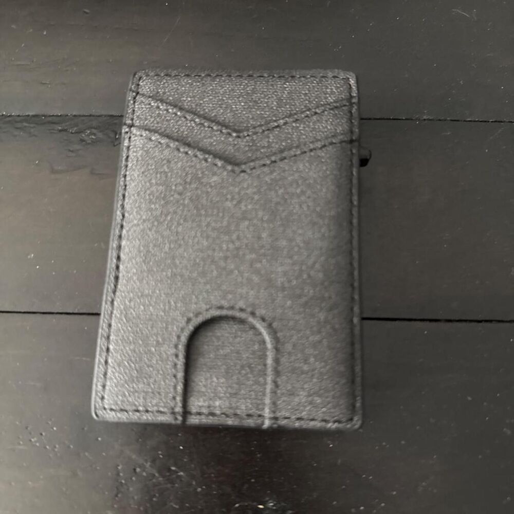 Black faux leather wallet with textured surface